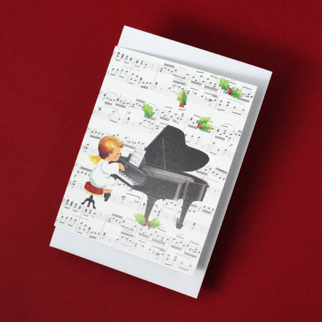 アンティークポストカード クリスマスにピアノを演奏する美しい少女と